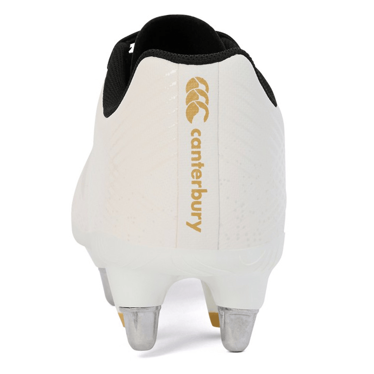 Rear view of the Canterbury Stampede Groundbreak Team SG rugby boot in white, featuring metal studs, a black collar, and gold Canterbury logo and text on the heel.