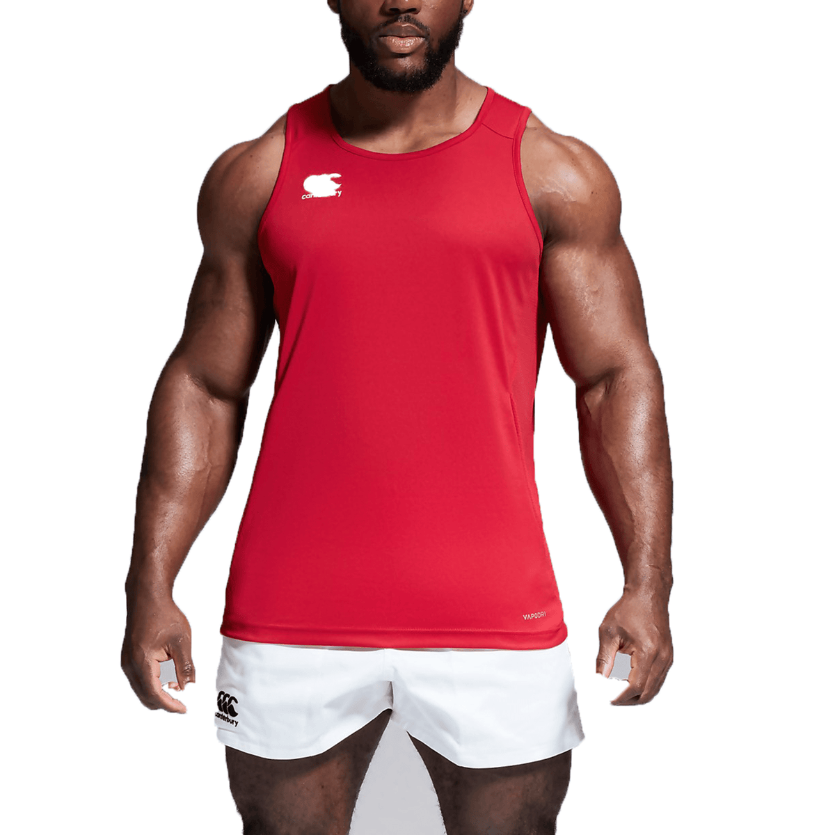 A man wearing a red Canterbury Club Dry Singlet and white shorts.
