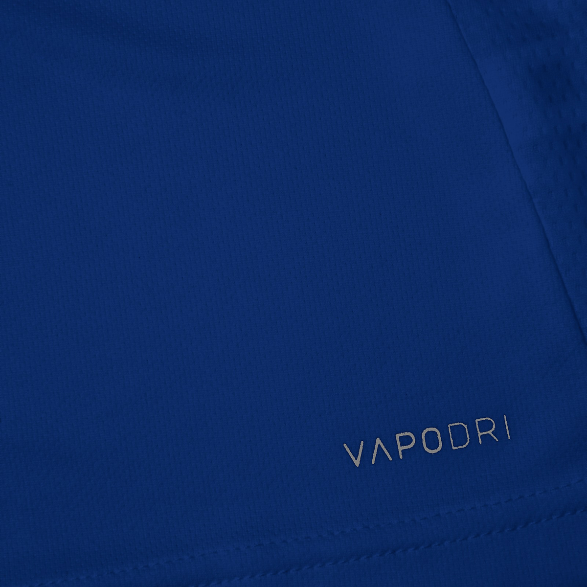 A close up of a blue Canterbury Club Dry Tee with the word vapor written on it.