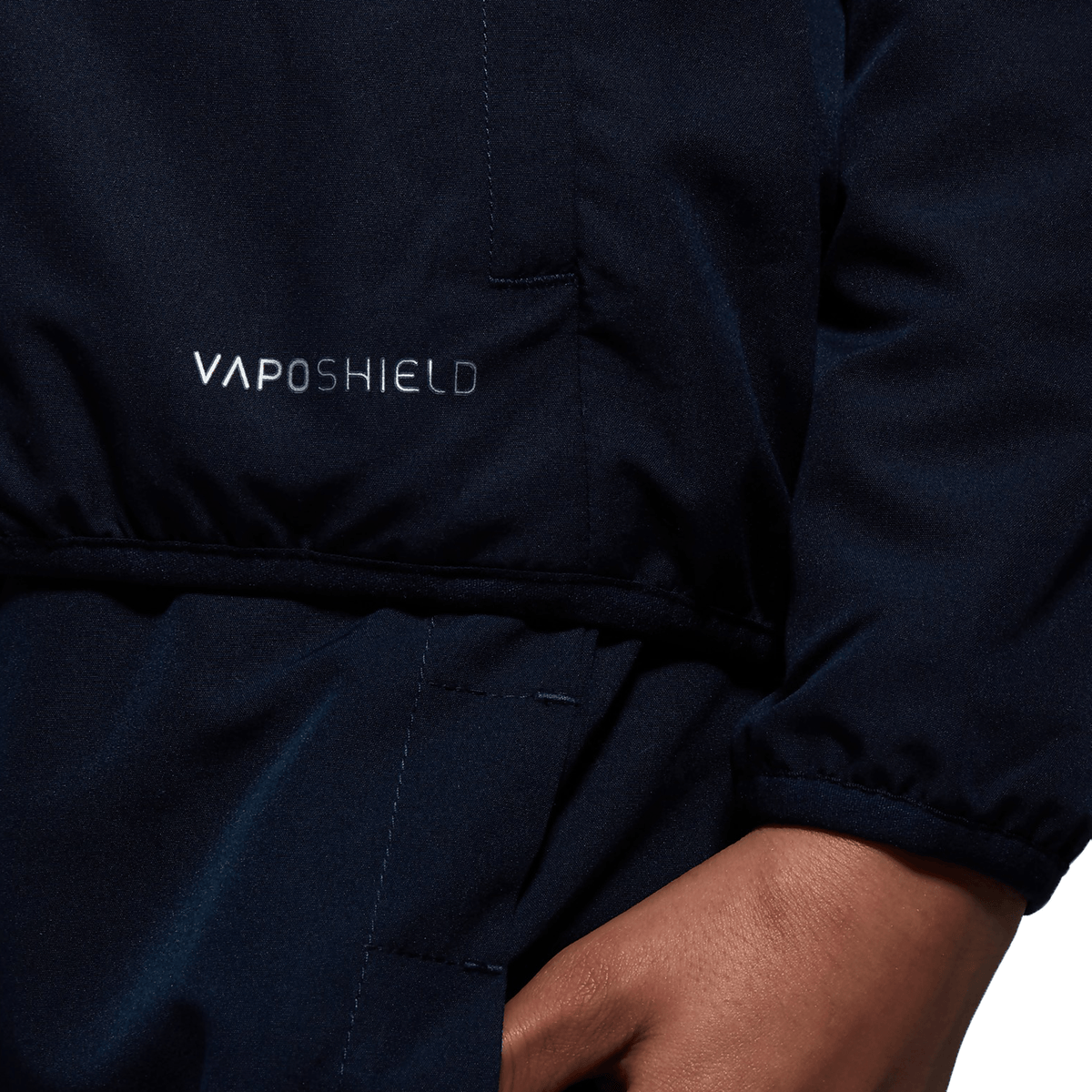 A close up of a person wearing a Canterbury Club Track Jacket.