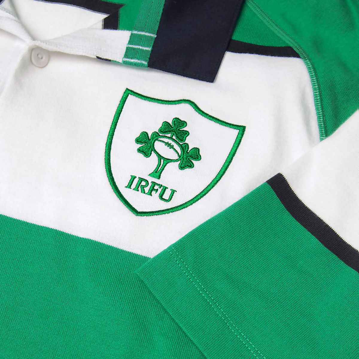 The Ireland 25/26 Heritage Hooped Jersey by Canterbury features classic green and white hoops and the iconic IRFU shamrock and rugby ball crest on the chest.