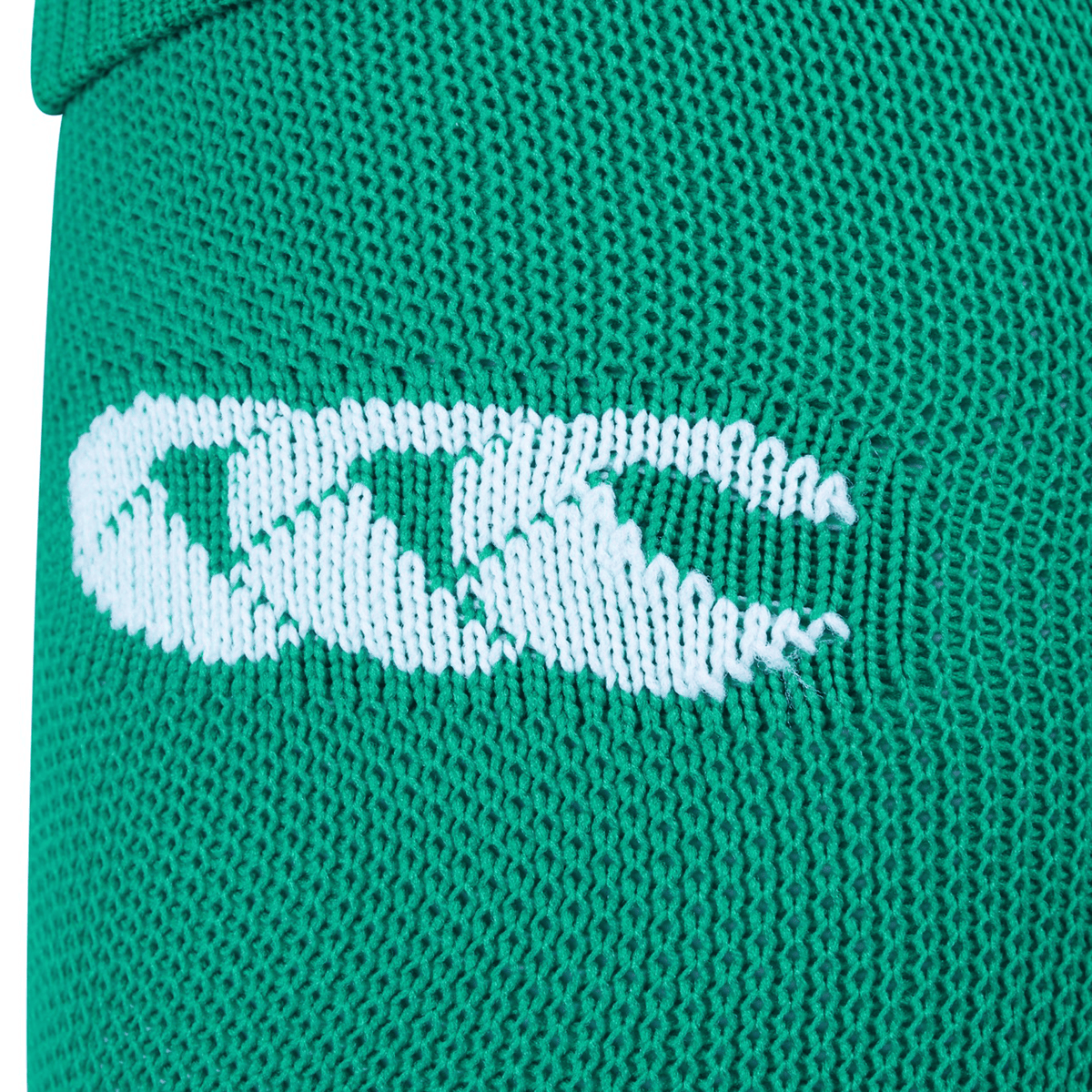 Close-up of green knitted fabric with a white embroidered Canterbury logo, highlighting the quality of Ireland Home Socks by Canterbury.