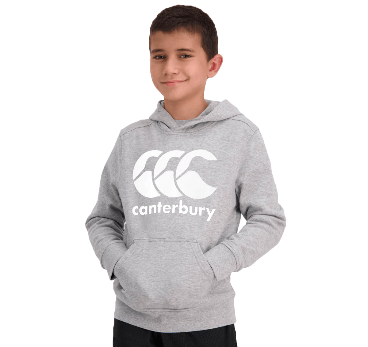 A boy wearing a Canterbury Anchor Hoodie with a white logo stands with his hands in the front pocket.