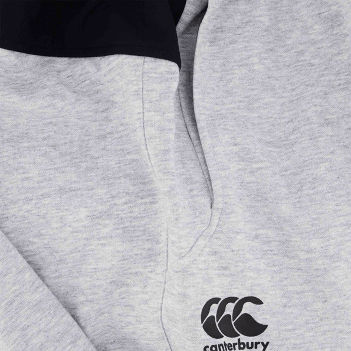 Close-up of a light gray Canterbury hoodie with black logo and neckline, ideal to pair with the Canterbury Tempo Vapodri Hybrid Cuffed Pant, featuring a tapered leg for a contemporary look.