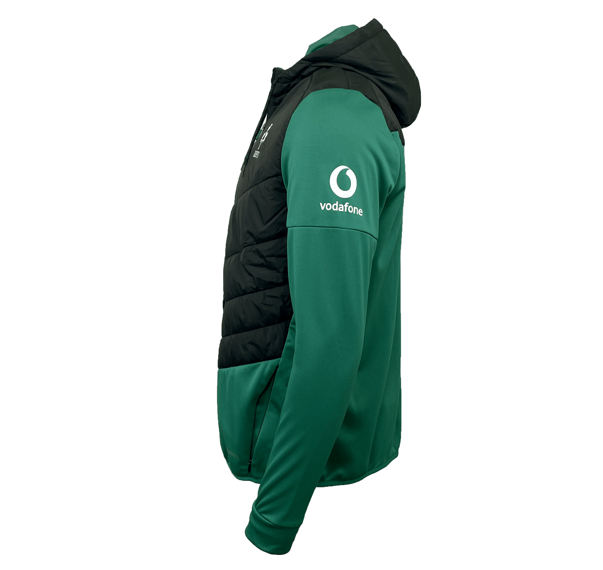 The Ireland 25/26 Hybrid Padded Jacket by Canterbury features green and black panels, a Vodafone sleeve logo, ThermoReg heat retention, and water resistance—ideal for unpredictable weather. Shown from the left side.