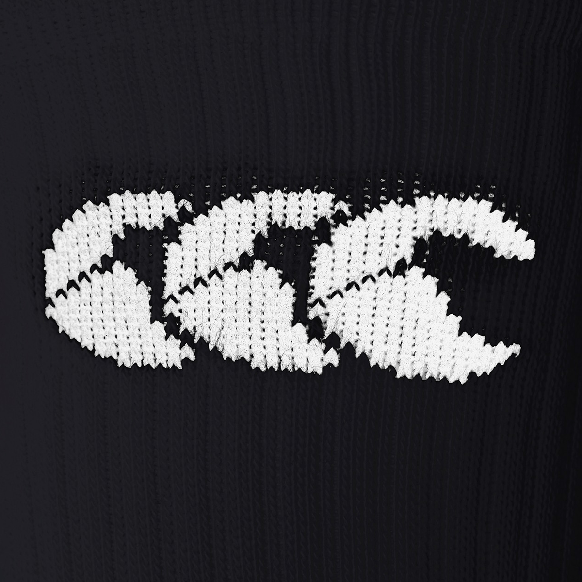 White Canterbury logo displayed on black fabric of the Canterbury Mid Calf Grip Sock.