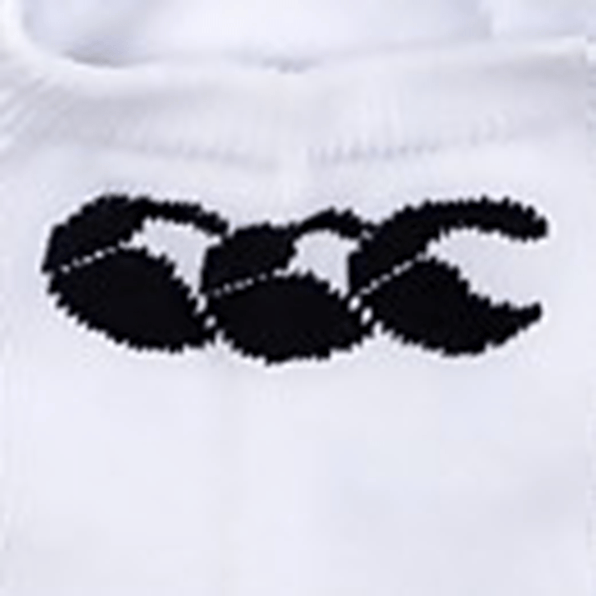 Close-up of the Canterbury Trainer Sock Liner, a white cotton-rich fabric garment featuring a black logo with three interlocking shapes resembling stylized claws or the letters "CCC".