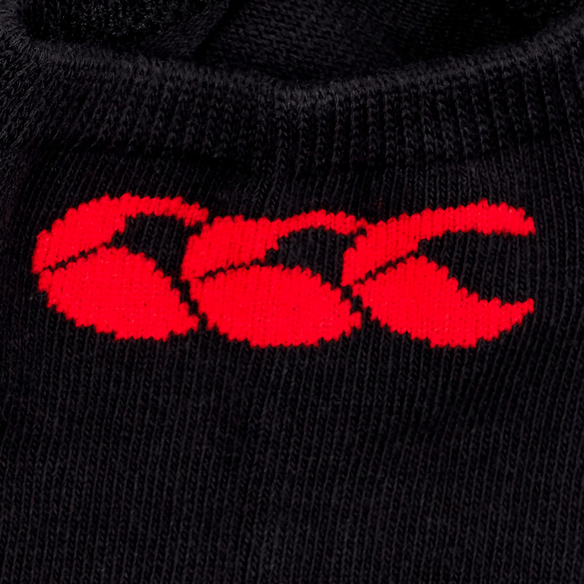 A close-up of the black Canterbury Trainer Sock Liner, detailed with a vibrant red embroidered CCC logo.