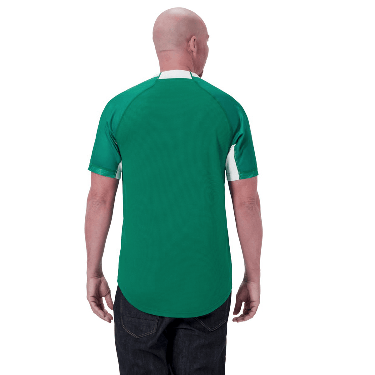 A bald man wearing an Ireland 24 Home Pro Jersey by Canterbury is standing with his back to the camera.