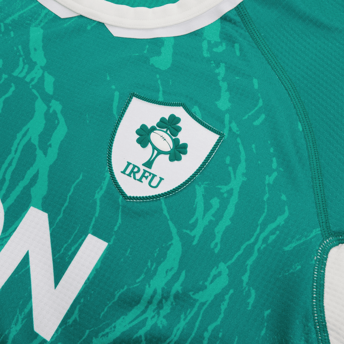 Women&#39;s Ireland WIRFU Home Pro Jersey by Canterbury showcases the Official IRFU crest with a rugby ball and shamrocks, enhanced by VapoDri technology for the perfect blend of tradition and comfort.