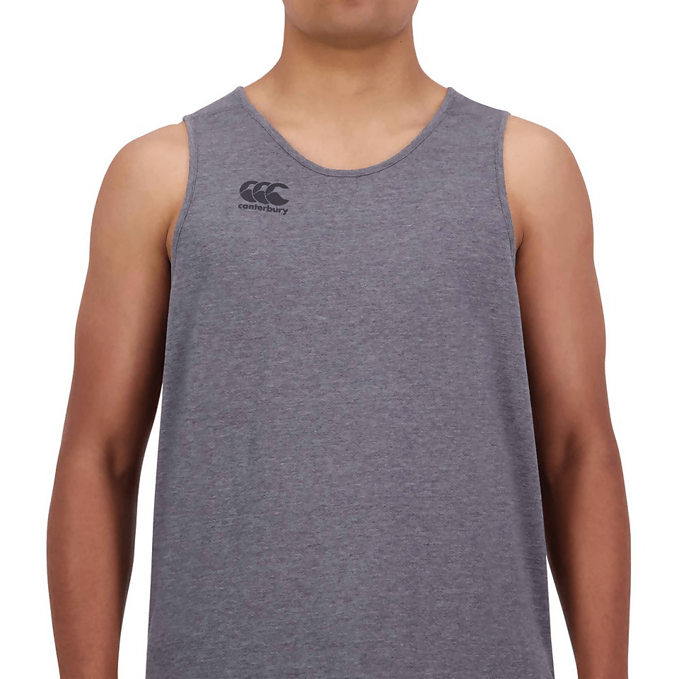 A man wearing a grey Canterbury Tempo Vapodri Singlet, featuring VapoDri technology.