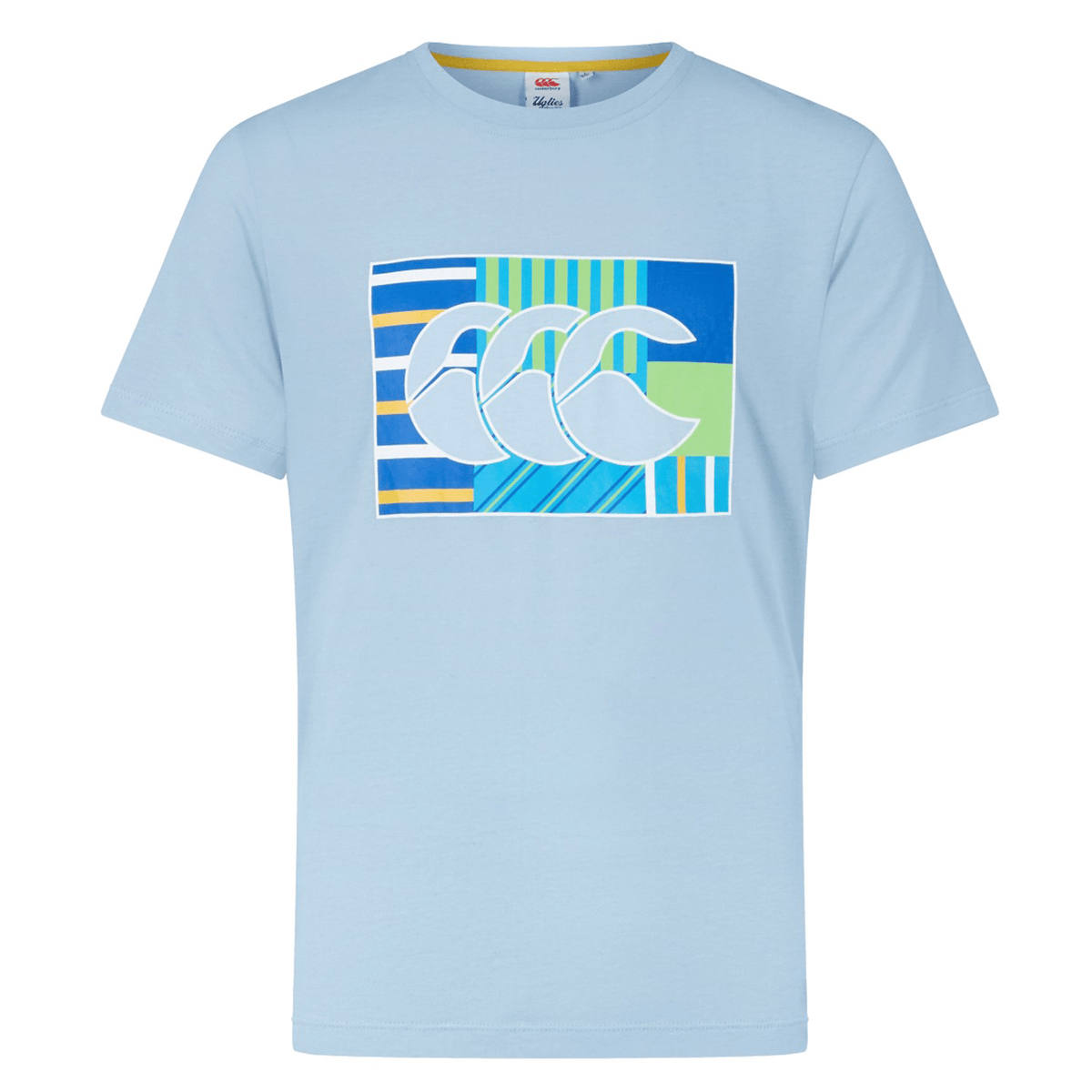 This Canterbury Uglies T-Shirt by Canterbury is a light blue piece featuring a graphic design with striped and solid patterns in blue, yellow, and green, accented by three overlapping CCC logos on the chest.