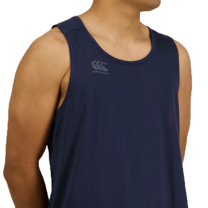 A person wearing a navy blue Canterbury Tempo Vapodri Singlet made from recycled polyester, featuring a &quot;Canterbury&quot; logo on the chest, is shown from the shoulders up, facing slightly right.