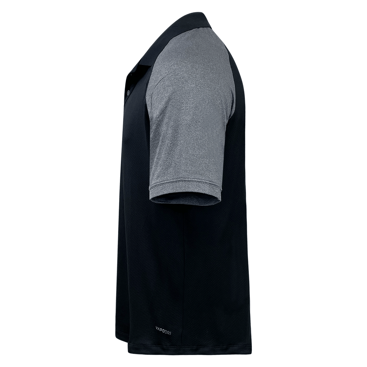Black and gray Canterbury Elite Polo shirt displayed from a side angle, featuring moisture-wicking Vapodri fabrics.