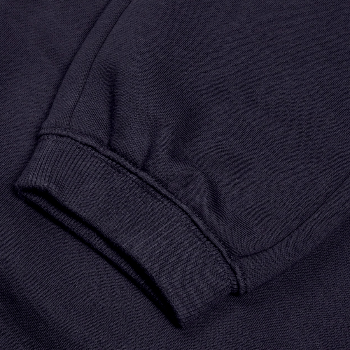 Close-up of a sleeve from Canterbury&#39;s Women&#39;s Leisure Sweatpant, featuring ribbed cuff detail in a navy blue, cotton blend fleece.