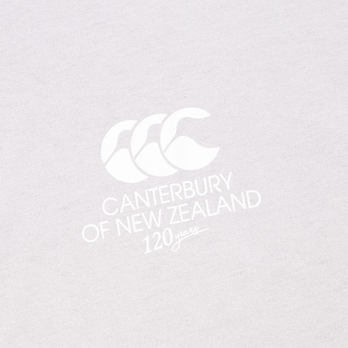 Canterbury Harlequin Block T-Shirt featuring an asymmetric design and a printed logo of Canterbury with "120 years" underneath.
