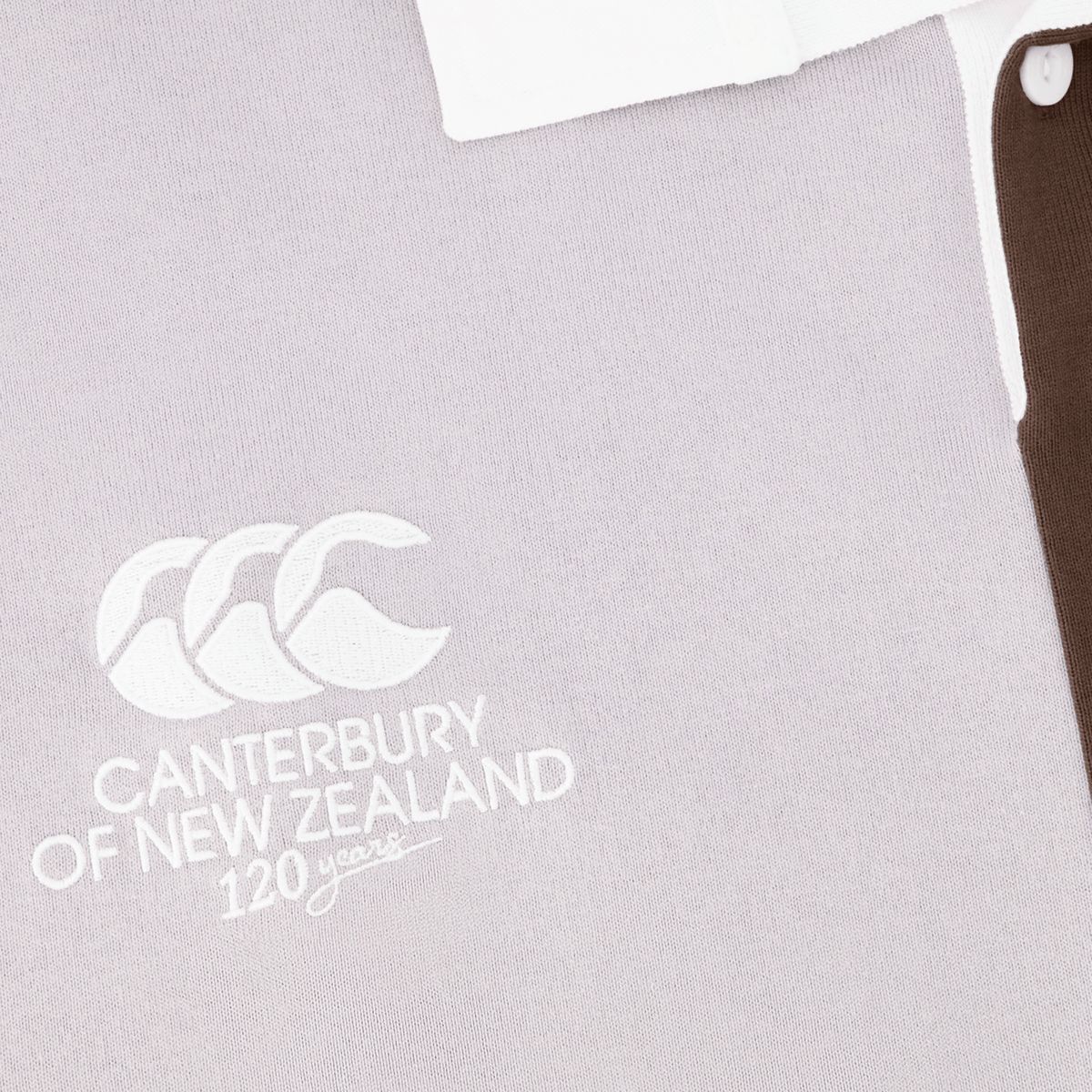 Close-up of the Canterbury Harlequin Block S/S Rugger rugby jersey featuring a white embroidered logo and text that reads &quot;Canterbury of New Zealand 120 years&quot;, with distinctive CCC 120 Years branding.