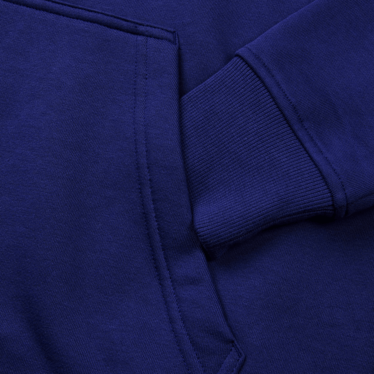 Close-up of the Canterbury Women&#39;s Uglies Hoodie in blue, showcasing a large pocket and ribbed sleeve cuffs with a flattering women&#39;s cut.
