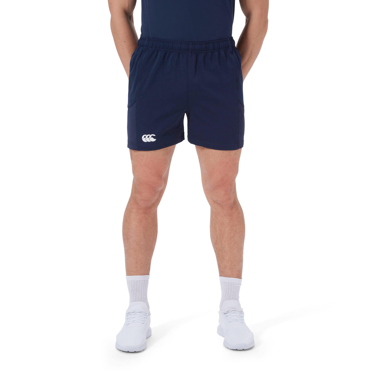 A person wearing the Canterbury Advantage Short 2.0 made from recycled content stands against a white background.