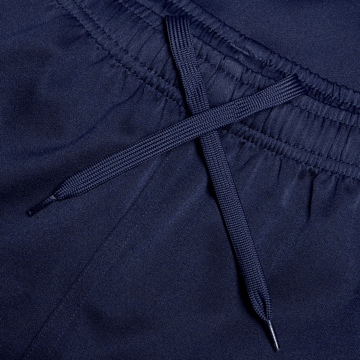 Close-up of the navy blue elastic waistband with a matching drawstring in an X shape, showcasing the adjustable fit and durability of the Canterbury Professional Short 2.0.