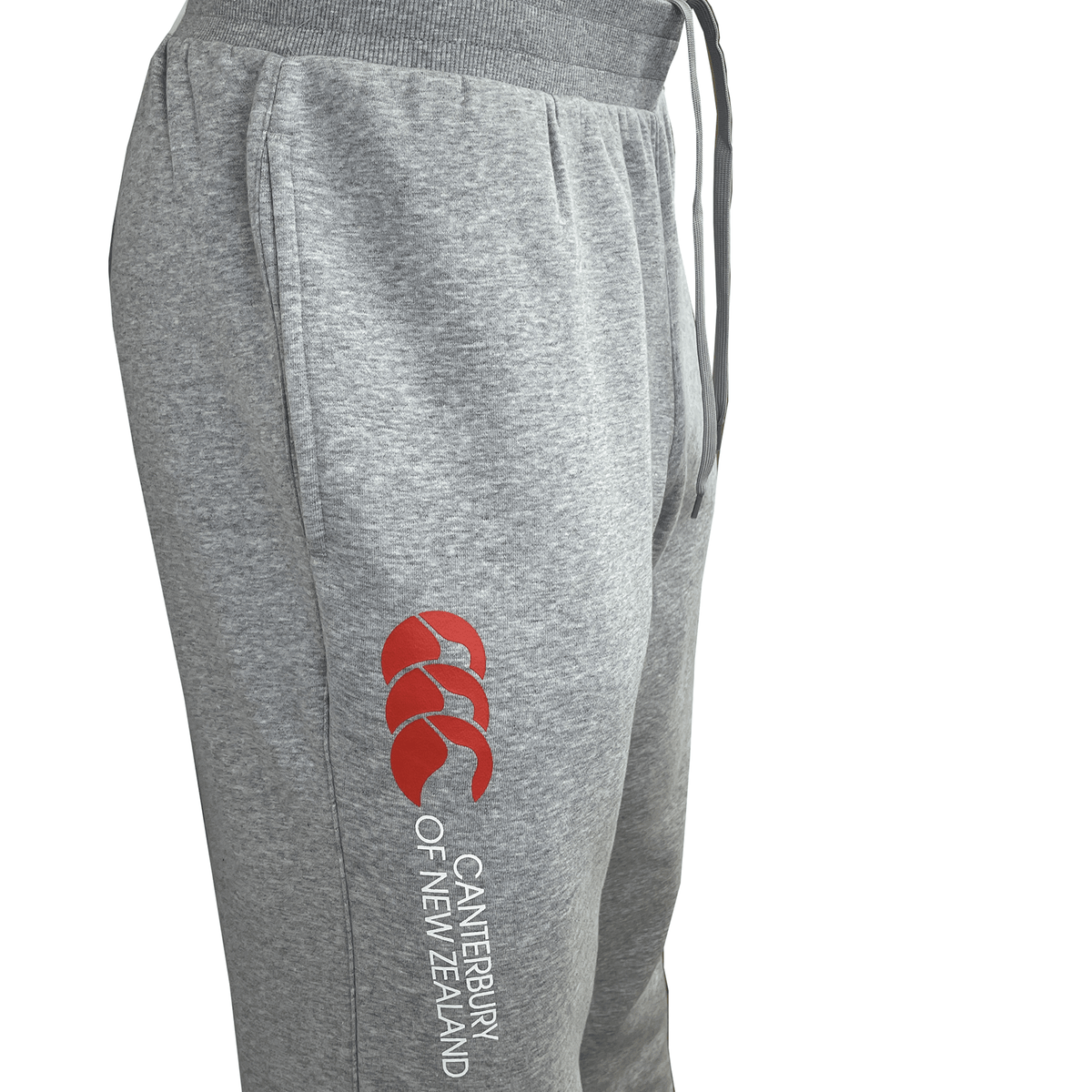 Canterbury of New Zealand Sweatpants by Canterbury with a red logo and text on the left leg. These cotton polyester fleece sweatpants feature an elastic waistband with drawstrings for an adjustable fit.