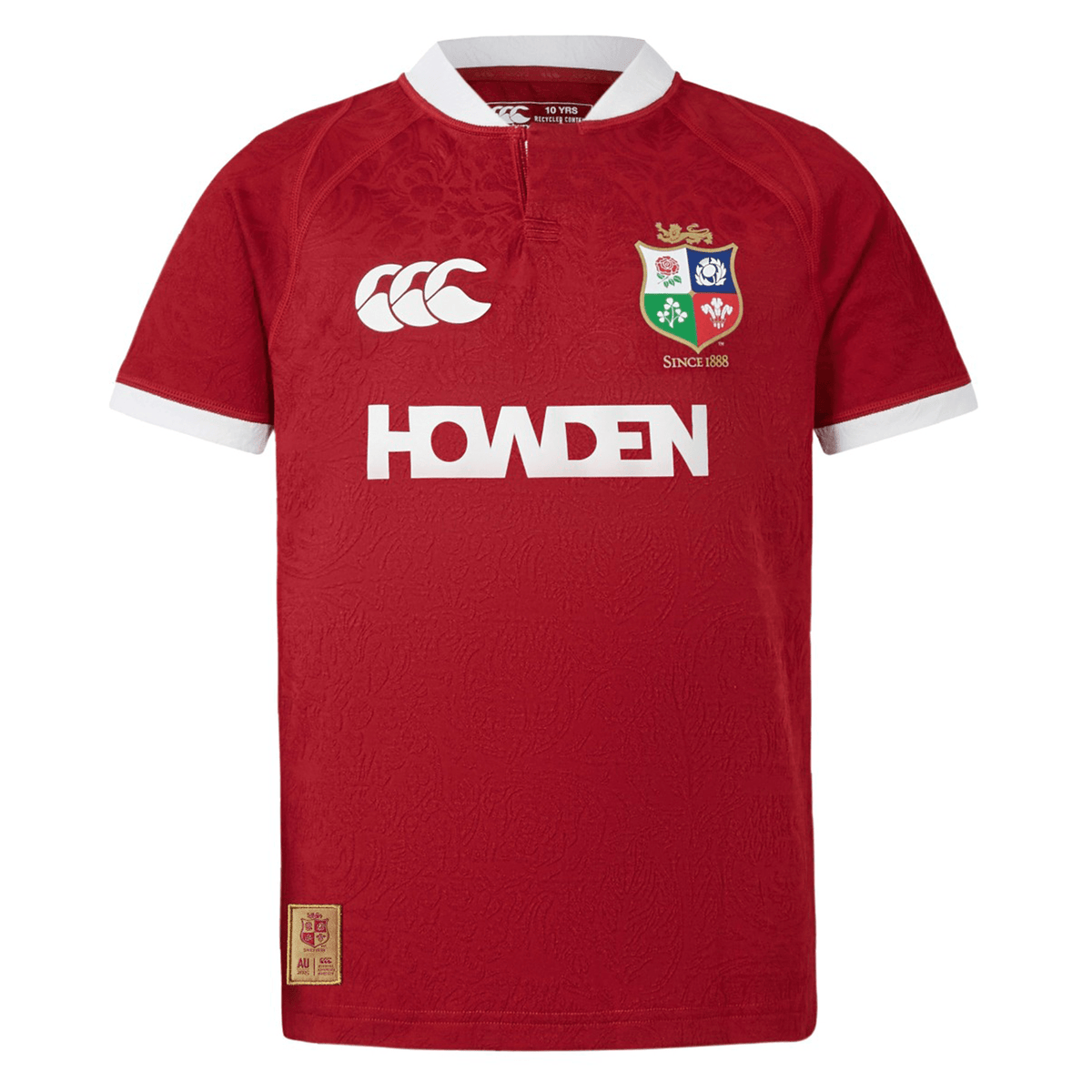 The Youth British &amp; Irish Lions 2025 Players Jersey by Canterbury features a red design with a white collar and cuffs, ergonomic paneling for comfort, the team logo on the left chest with &quot;1888&quot; below it, and &quot;HOWDEN&quot; in white across the front.