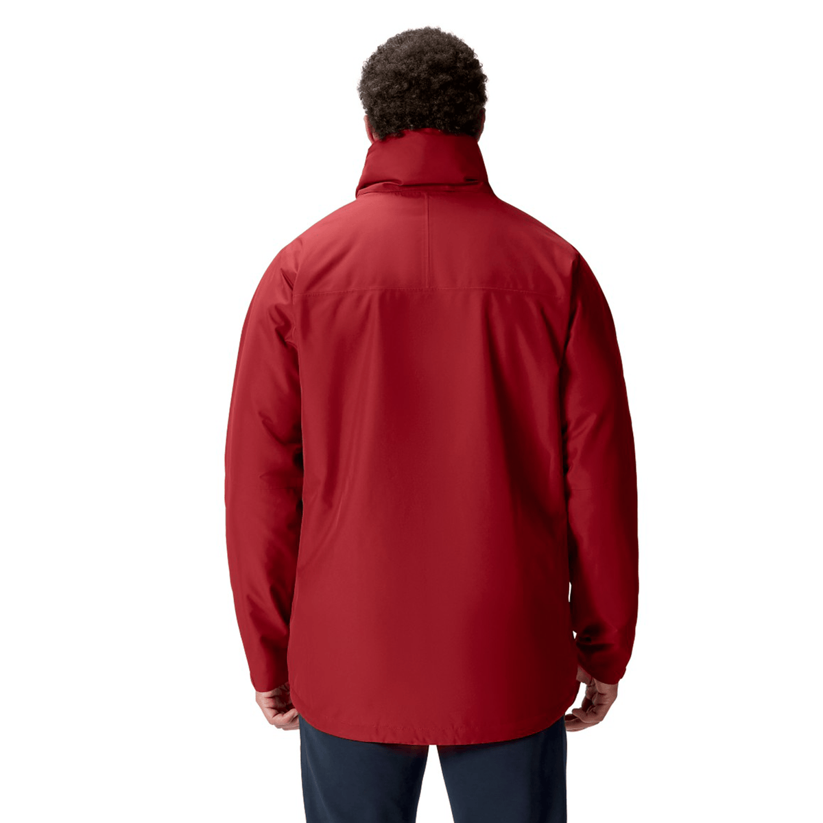 A person wearing a British &amp; Irish Lions 2025 Waterproof Jacket by Canterbury in red, paired with dark pants, is shown from the back against a plain background.