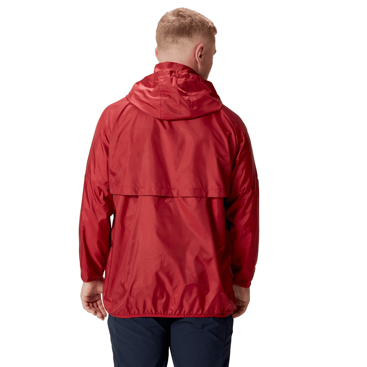 A person wearing a British &amp; Irish Lions 2025 Lightweight Rain Jacket by Canterbury in red, seen from the back, stands against a white background.