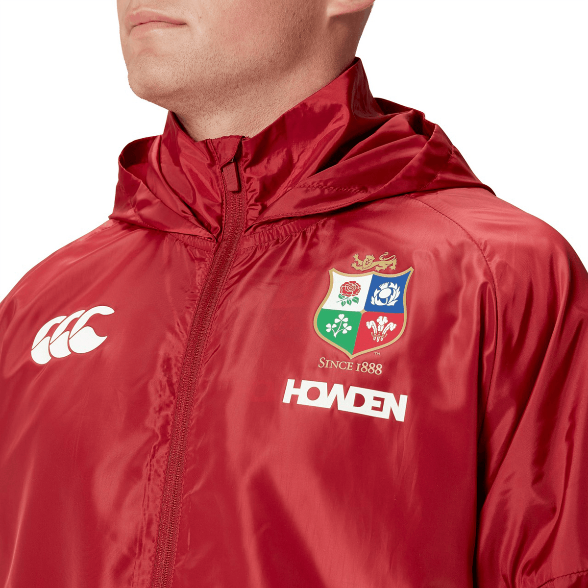 Sporting a lightweight, water-resistant hooded jacket from the British &amp; Irish Lions 2025 collection, this red Canterbury garment features the "Since 1888" and "HOWDEN" logo, making it perfect for fans.
