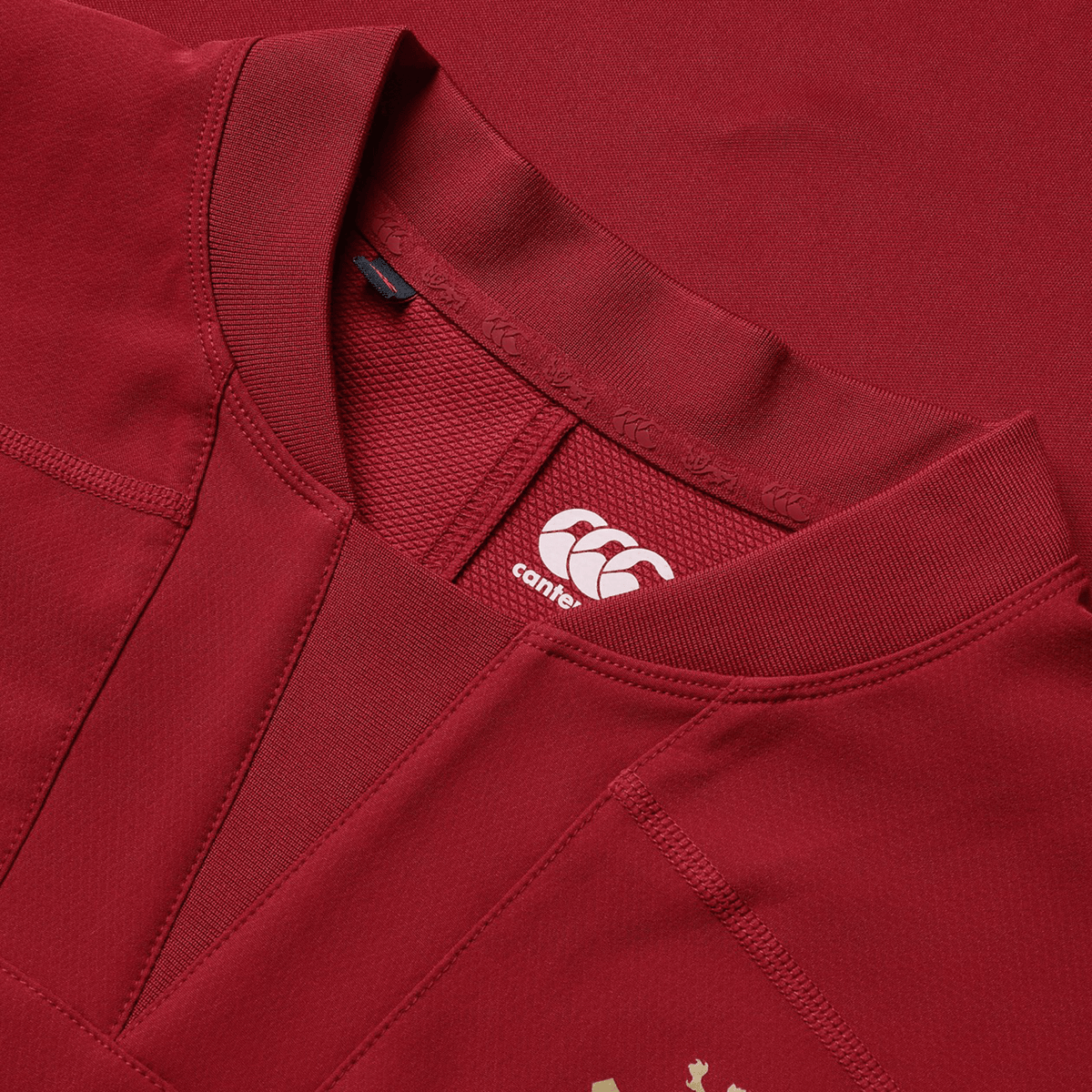 Close-up of the British &amp; Irish Lions 25 Drill Top by Canterbury, showcasing the Canterbury logo on the inner neckline and intricate stitching on the fabric, reminiscent of designs from the British &amp; Irish Lions collection.