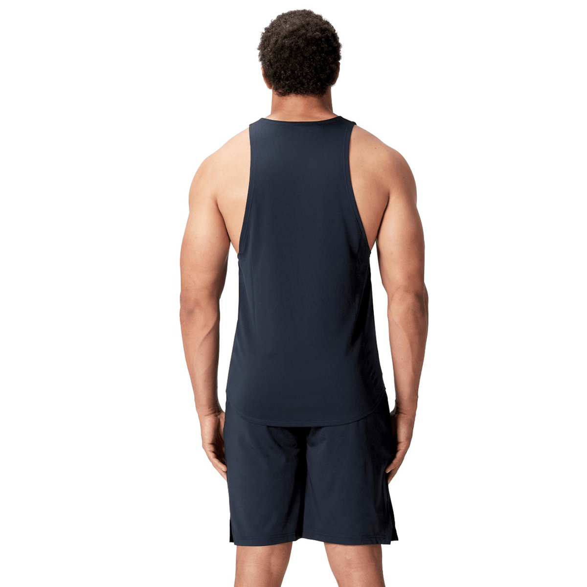 A person wearing a sleeveless British &amp; Irish Lions 25 Poly Singlet by Canterbury in black, along with matching black shorts, is facing away from the camera against a white background.