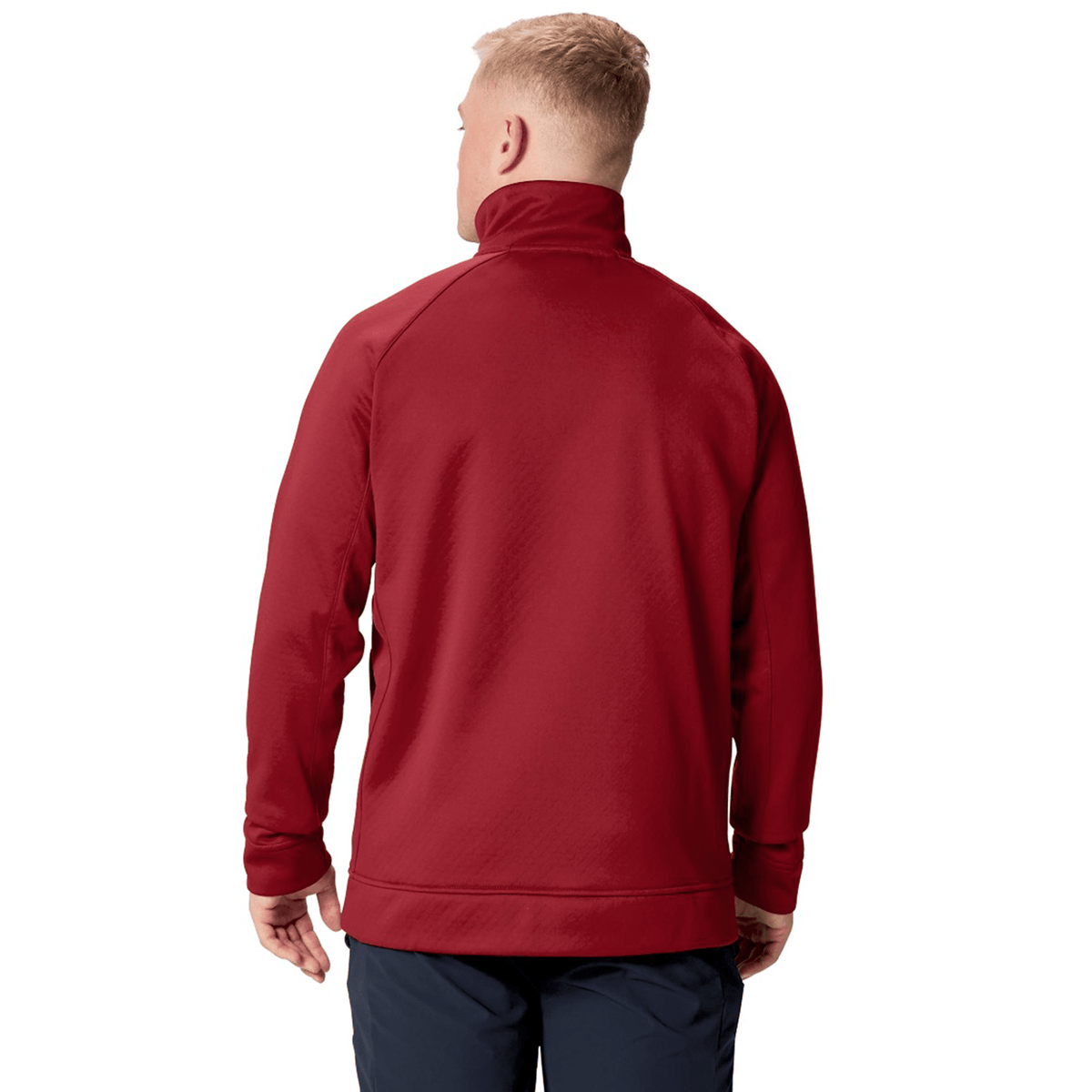 A person with short blond hair is wearing the Canterbury British &amp; Irish Lions 2025 1/4 Zip Fleece in red, paired with dark pants, as they face away from the camera.