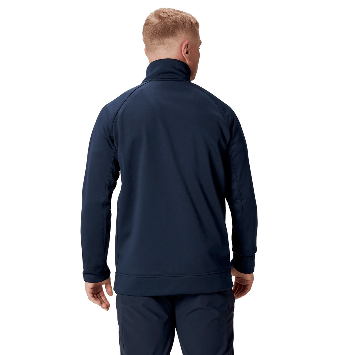 A person clad in the British &amp; Irish Lions 2025 1/4 Zip Fleece by Canterbury and pants is standing with their back to the camera, evoking the classic style typically associated with British &amp; Irish Lions apparel.