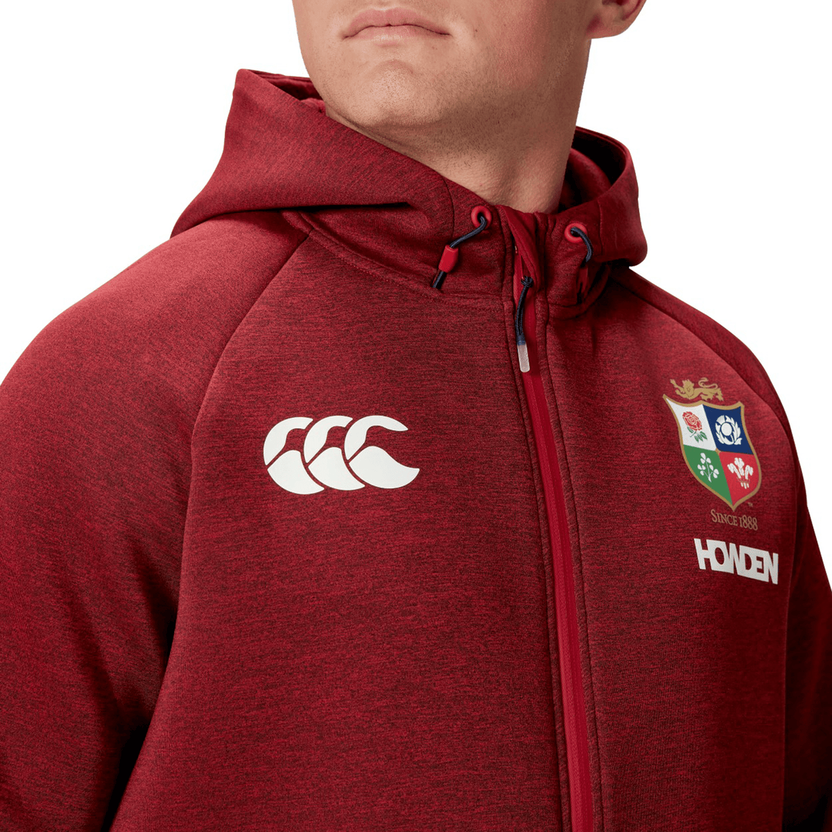 A person wearing the maroon British &amp; Irish Lions 2025 Everest Hoodie by Canterbury, featuring a lion logo and "HODEN" across the chest, complemented by the iconic Canterbury emblem on the shoulder. This stylish hoodie is made from recycled polyester for an eco-friendly fashion statement.
