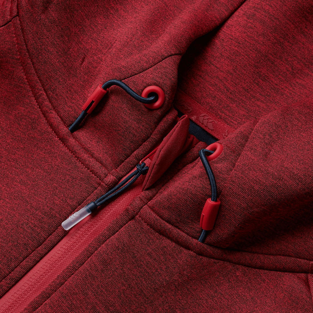 Close-up of a Canterbury British &amp; Irish Lions 2025 Everest Hoodie, showcasing its red color with dark drawstrings and plastic toggles.