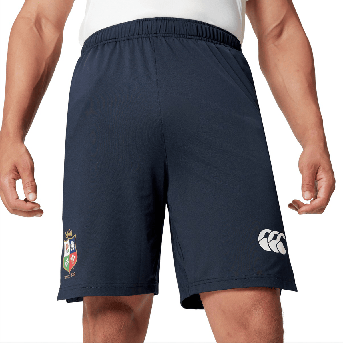 An individual dressed in navy British &amp; Irish Lions 2025 Training Shorts by Canterbury, showcasing the sports logo on the left leg.