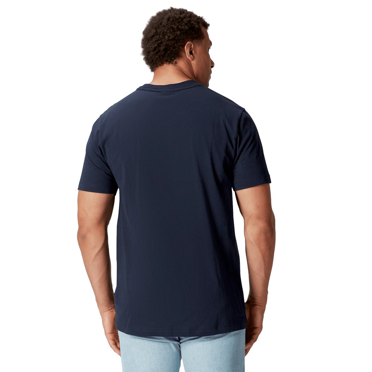 A man in a British &amp; Irish Lions 2025 Cotton Jersey Tee by Canterbury and light jeans is viewed from the back, standing against a white background.