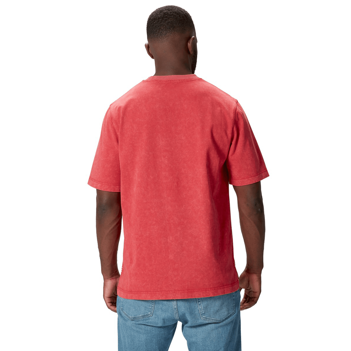A person wearing a red British &amp; Irish Lions 25 Heritage Tee by Canterbury and blue jeans stands with their back to the camera against a white background, embodying the spirit of Canterbury&#39;s craftsmanship.