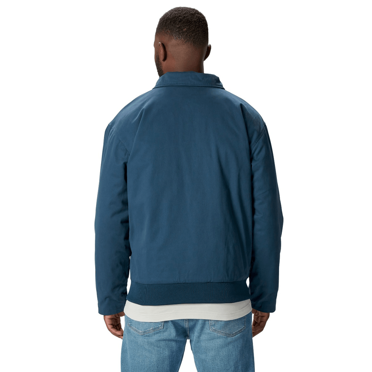 A person wearing the British &amp; Irish Lions 2025 Heritage Quilted Jacket by Canterbury with jeans is shown from the back against a plain white background, showcasing the classic style associated with Canterbury and the British &amp; Irish Lions.
