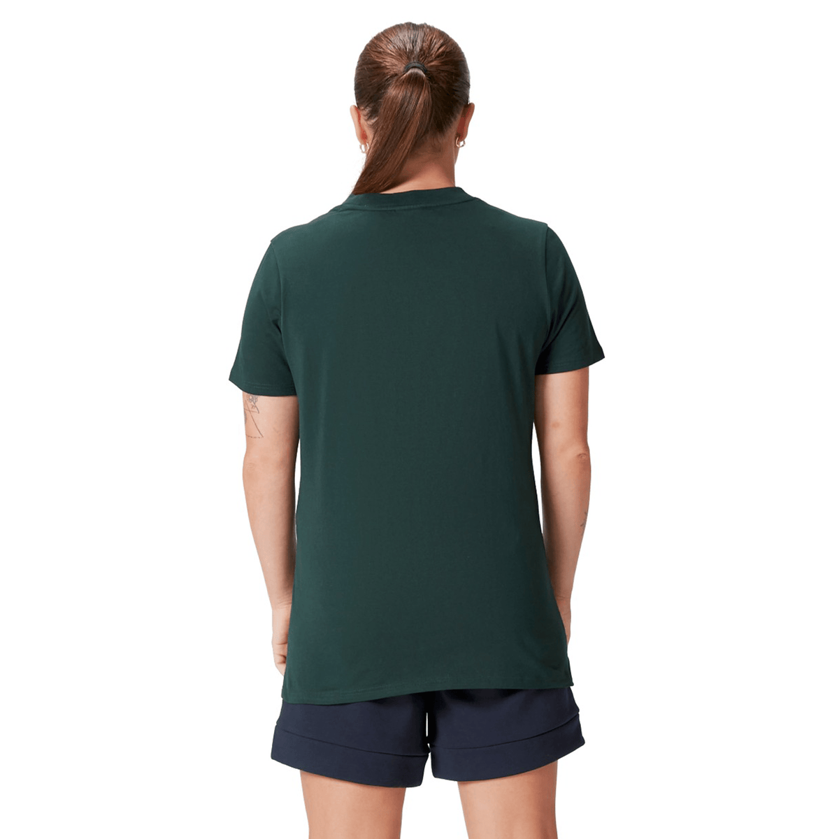 A person with a ponytail wearing a Women's British &amp; Irish Lions 25 Cotton Jersey Tee by Canterbury in dark green and navy shorts, viewed from the back.