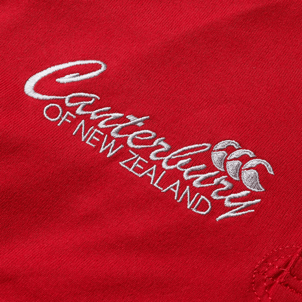 The British &amp; Irish Lions 2025 Heritage Jersey by Canterbury highlights red fabric with the distinguished white embroidered logo of Canterbury, showcasing their signature three overlapping C&#39;s design.