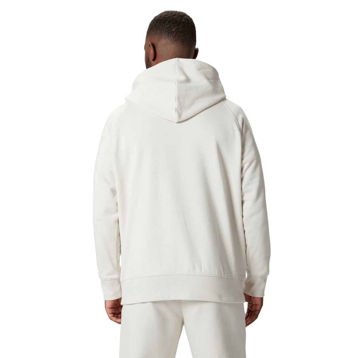 Dressed in the Canterbury British &amp; Irish Lions 2025 Outback Fleece Hoodie and pants, a person facing away from the camera perfectly captures the adventurous spirit synonymous with the British &amp; Irish Lions.