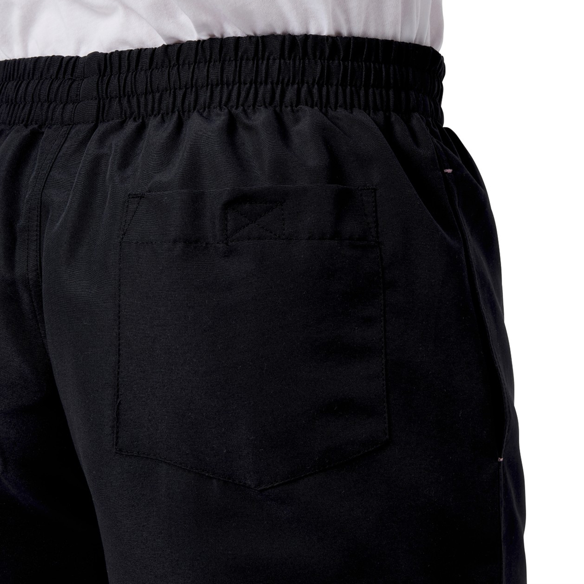 A person is seen from the back wearing Canterbury&#39;s Women&#39;s Canterbury Uglies 5&quot; Tactic Shorts, featuring an elastic waistband and pockets, with the top of a white, smooth polyester shirt visible just above the shorts.