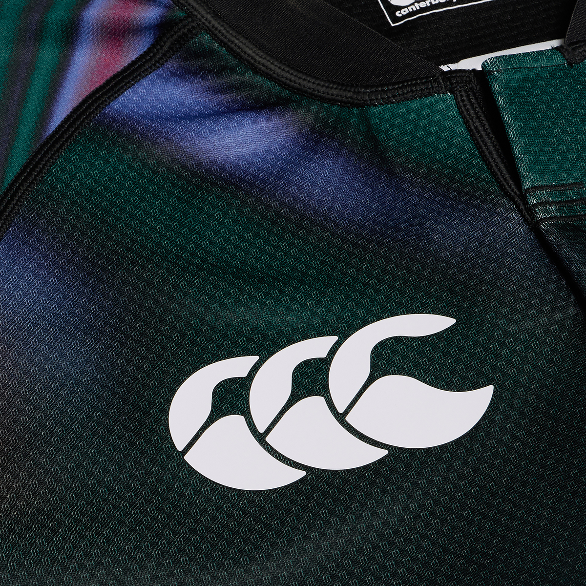 Close-up of the Ireland 25/26 Pre Game Pro Jersey by Canterbury, highlighting the white Canterbury logo on its textured green fabric.