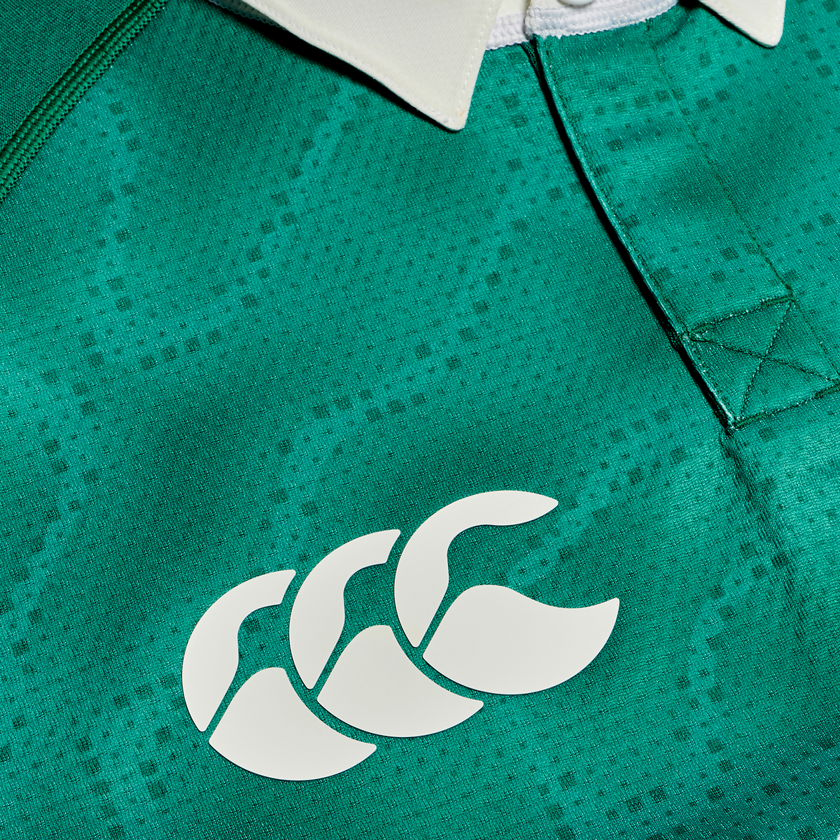 Close-up of the Ireland 25/26 Home Test Jersey by Canterbury, featuring a green design with a white collar and the iconic three overlapping C’s logo—an official performance jersey crafted for Ireland rugby fans.