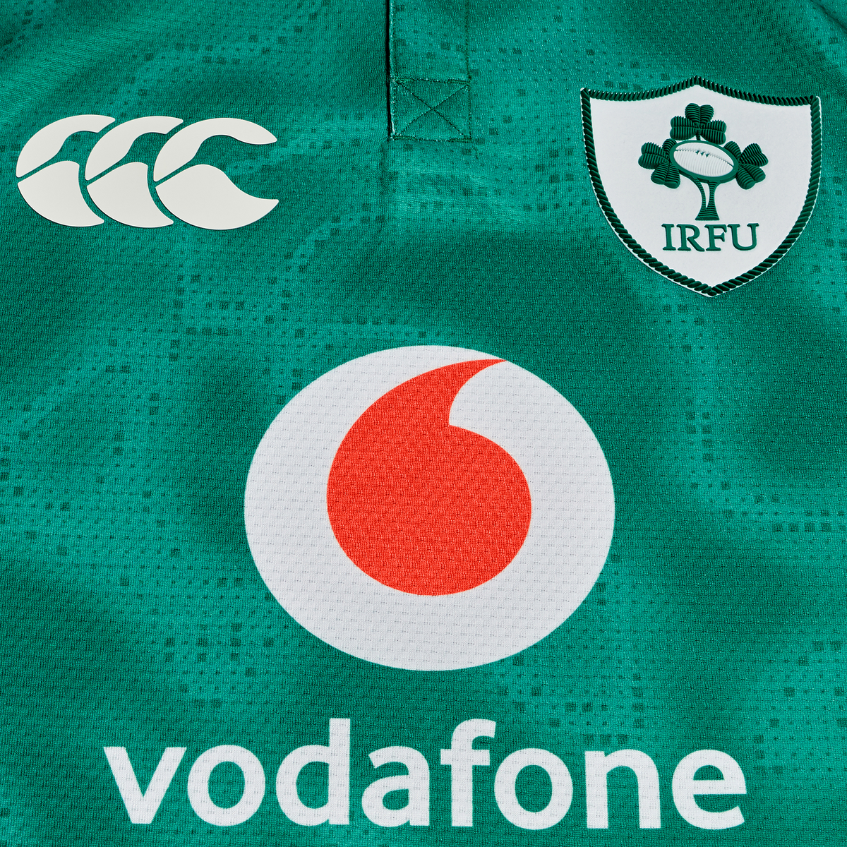 Close-up of the Ireland 25/26 Home Test Jersey by Canterbury, featuring the IRFU shamrock crest and Vodafone sponsor on premium green fabric.