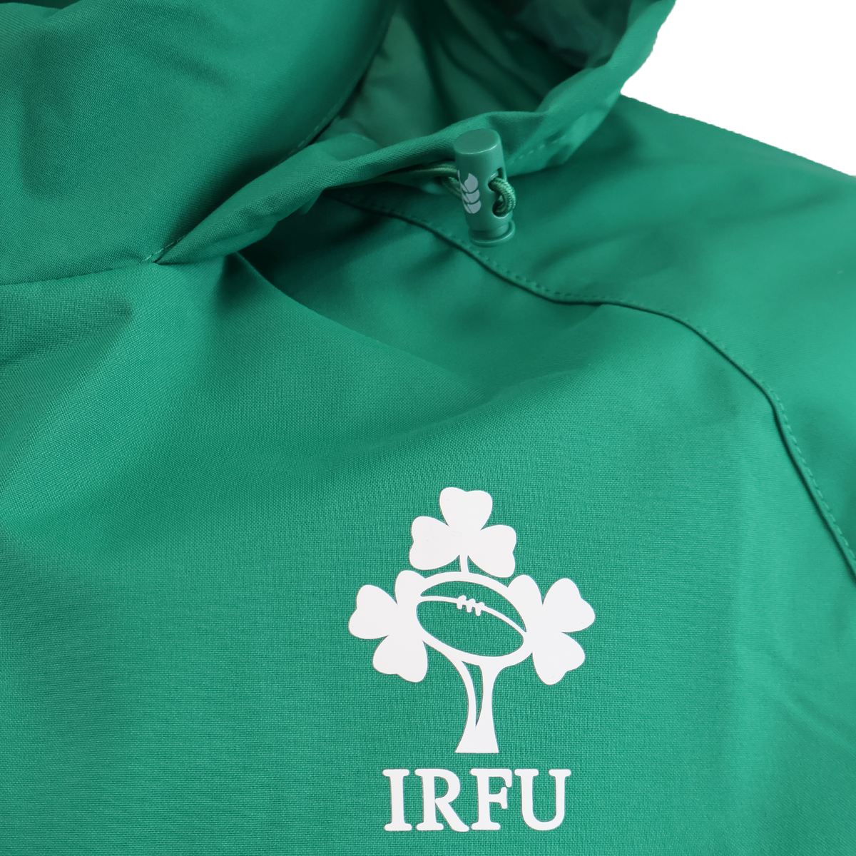 A close-up of the Ireland 25/26 Anthem Jacket by Canterbury, showcasing the IRFU logo with rugby ball and shamrock details, crafted using VapoShield technology.