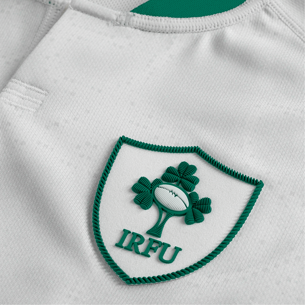 Close-up of the Youth Ireland 25/26 Alternate Pro Jersey by Canterbury, highlighting the iconic IRFU crest with its shamrock and rugby ball design.