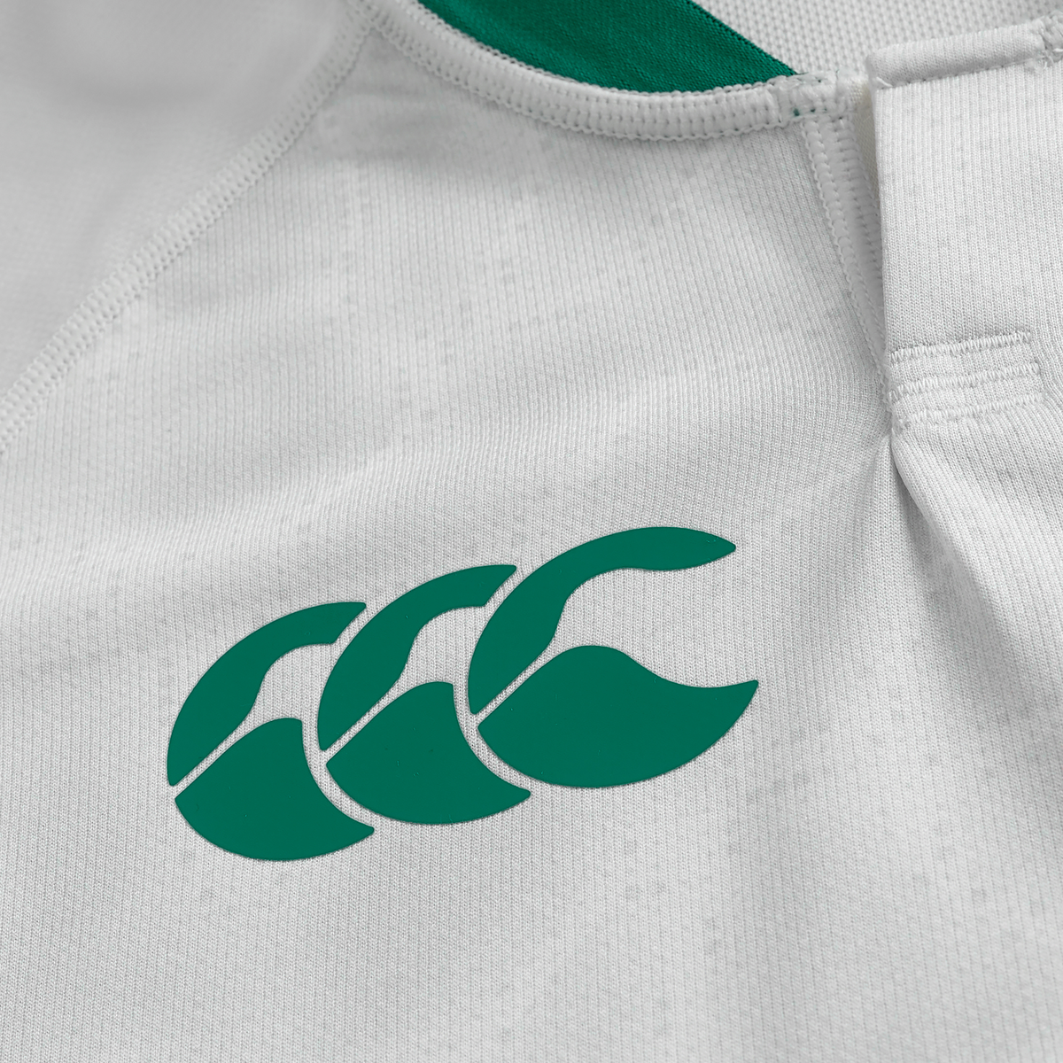 Close-up of the Youth Ireland 25/26 Alternate Pro Jersey by Canterbury, featuring the green Canterbury logo on white fabric.