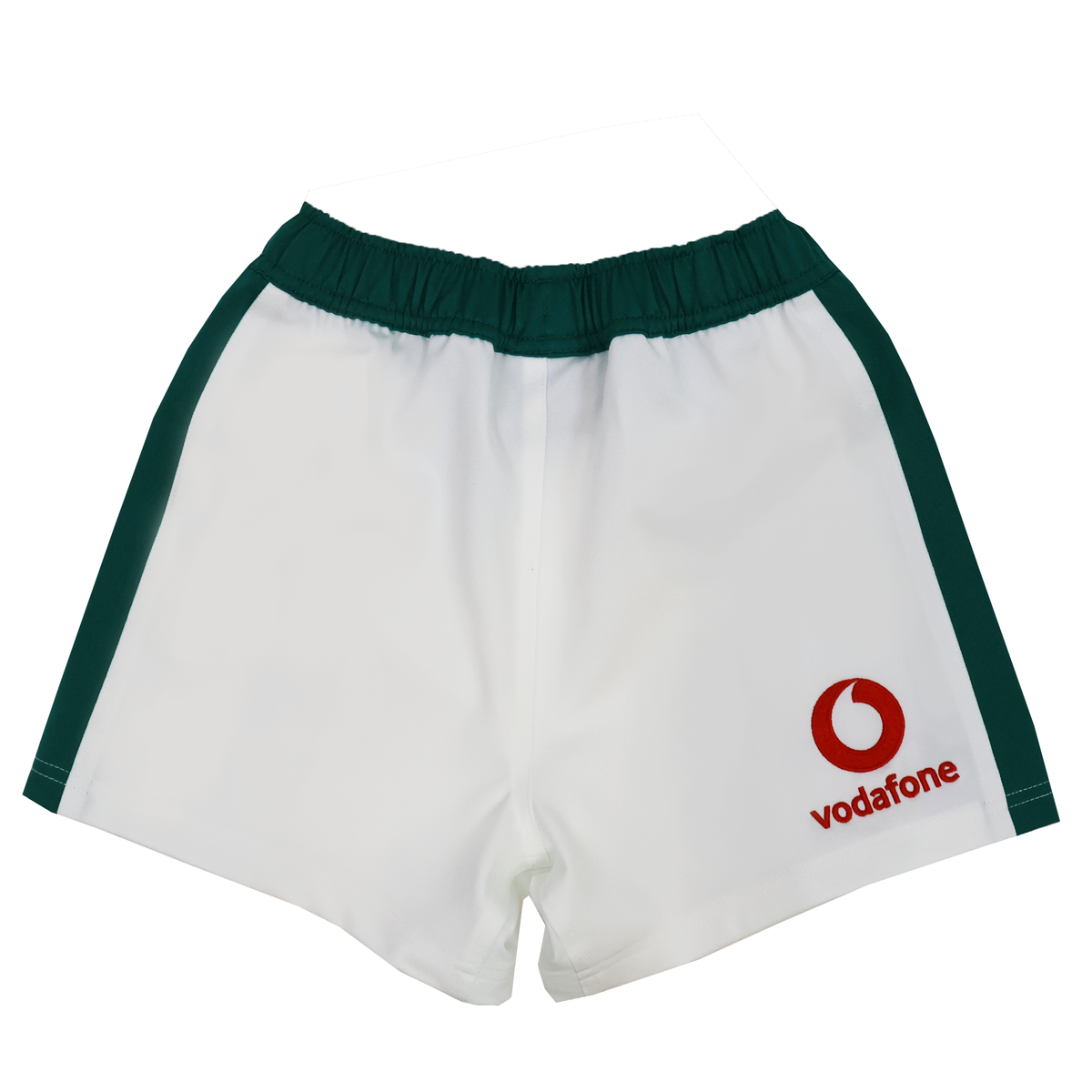 The Youth Ireland 25/26 Home Match Short by Canterbury features white fabric, green side stripes, and a red Vodafone logo on the lower right leg—official IRFU youth rugby shorts.